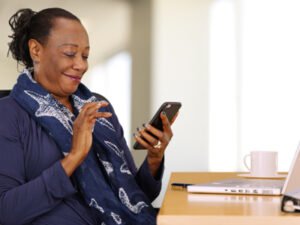 Woman calling healthcare provider on her mobile phone